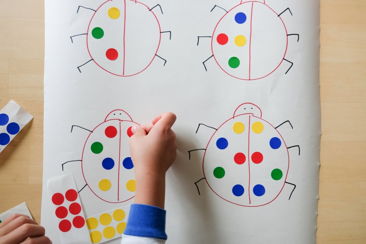 garden theme learning activities: ladybug dot sticker symmetry
