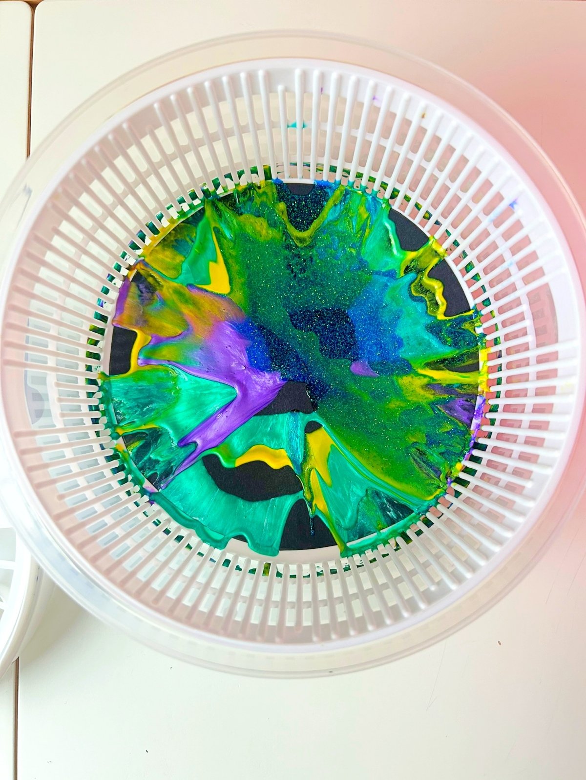 paint patterns inside a salad spinner